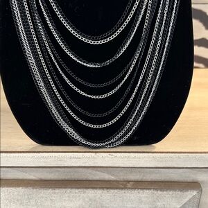 Multi Strand silver and black chains necklace  chunky silver chain at back. Boho